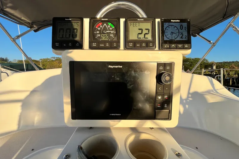 Slide: The Image of Sailing instruments on a 1996 Catalina 400 yacht, featuring Raymarine displays. - 10