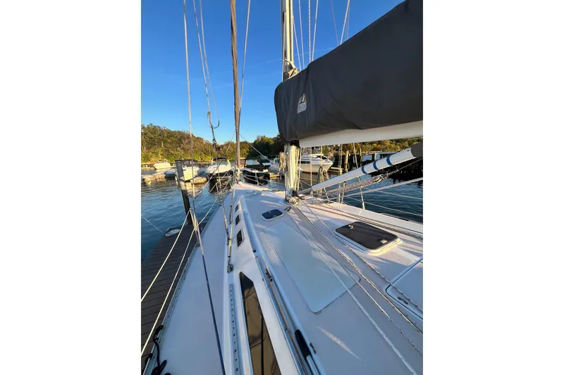 Slide: The Image of Sailboat Catalina 400, 1996 model, docked at marina under clear blue sky. - 17