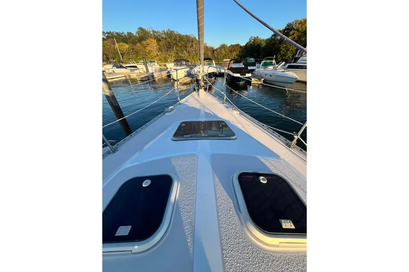 Slide: The Image of Deck view of a 1996 Catalina 400 sailboat docked in a marina. - 18