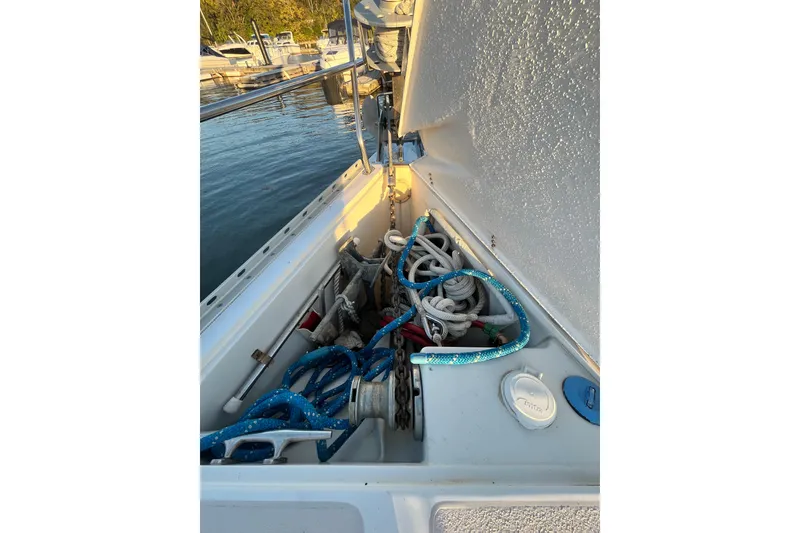 Slide: The Image of Anchor locker of a 1996 Catalina 400 sailboat with ropes and chains. - 20