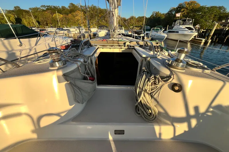 Slide: The Image of Cockpit of 1996 Catalina 400 sailboat docked at marina, ropes and winches visible. - 28
