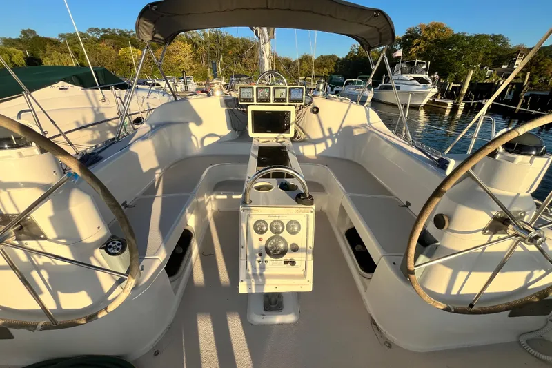 Slide: The Image of Cockpit of a 1996 Catalina 400 sailboat with dual steering wheels and navigation instruments. - 3