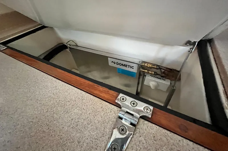 Slide: The Image of Open compartment in 1996 Catalina 400 yacht showing Dometic equipment. - 36