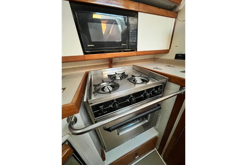 Slide: The Image of Galley kitchen in 1996 Catalina 400 yacht with stove and microwave. - 38