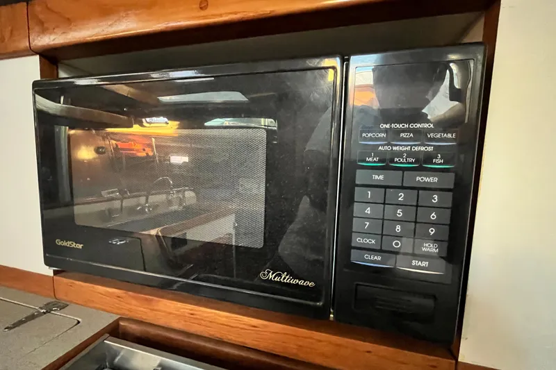 Slide: The Image of GoldStar microwave in 1996 Catalina 400 yacht kitchen, featuring one-touch controls. - 39