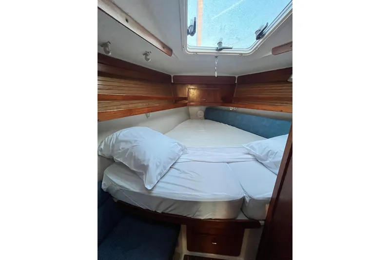 Slide: The Image of Cozy cabin interior of 1996 Catalina 400 sailboat with wooden accents and skylight. - 49