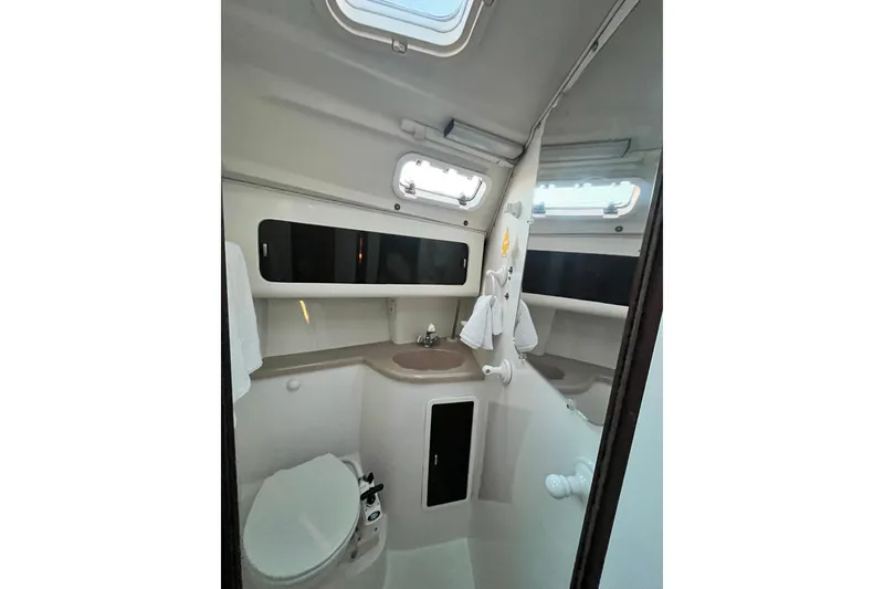 Slide: The Image of Bathroom interior of a 1996 Catalina 400 yacht, featuring sink and toilet. - 51