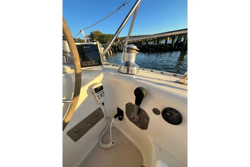 Slide: The Image of Cockpit of 1996 Catalina 400 sailboat with steering wheel and navigation equipment. - 6