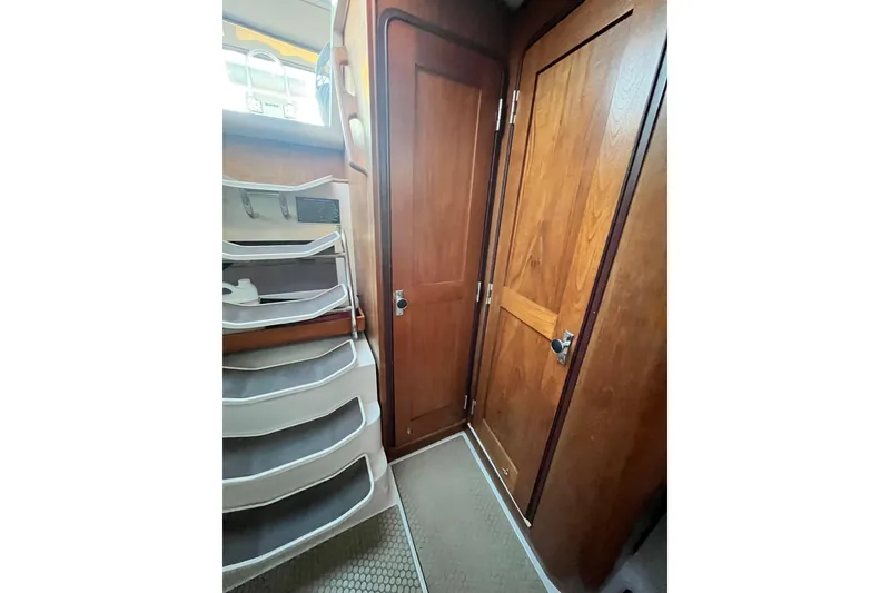 Slide: The Image of Interior of 1996 Catalina 400 sailboat with wooden doors and staircase. - 60