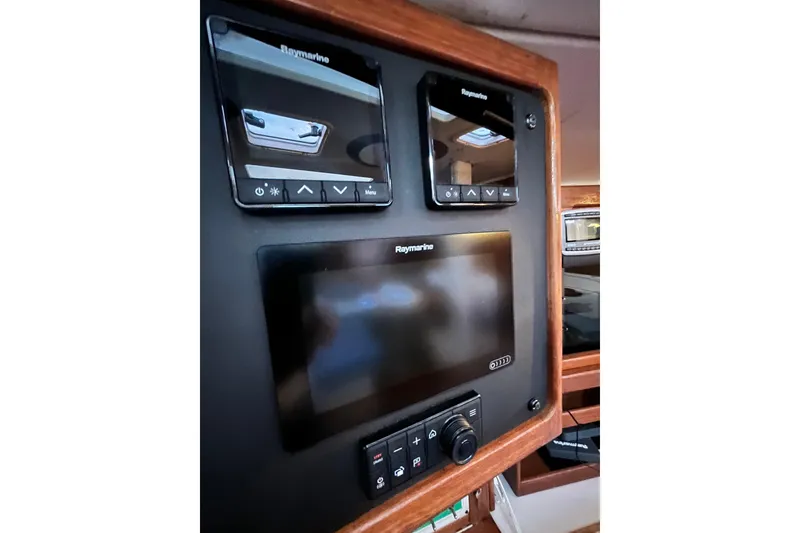 Slide: The Image of Control panel of a 1996 Catalina 400 sailboat with Raymarine displays. - 66