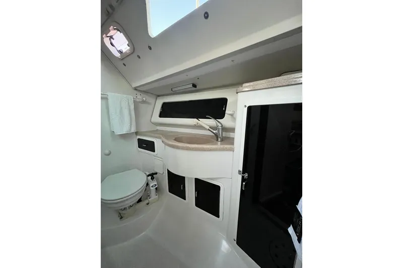 Slide: The Image of Bathroom interior of a 1996 Catalina 400 sailboat, featuring sink and toilet. - 73