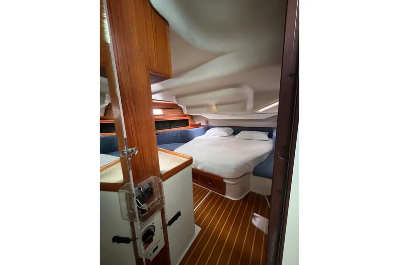 Slide: The Image of Cozy cabin interior of a 1996 Catalina 400 sailboat with a comfortable bed. - 76