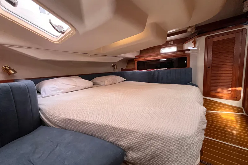 Slide: The Image of Cozy cabin interior of a 1996 Catalina 400 yacht with a comfortable bed. - 79