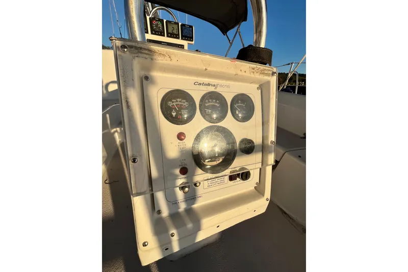 Slide: The Image of Control panel of a 1996 Catalina 400 yacht, featuring gauges and indicators. - 8