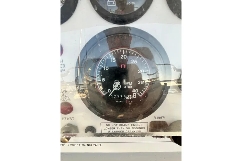 Slide: The Image of Tachometer gauge on a 1996 Catalina 400 boat dashboard, showing RPM and engine hours. - 9