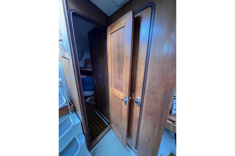 Slide: The Image of Interior view of 1996 Catalina 400 sailboat with wooden doors and cabin access. - 96