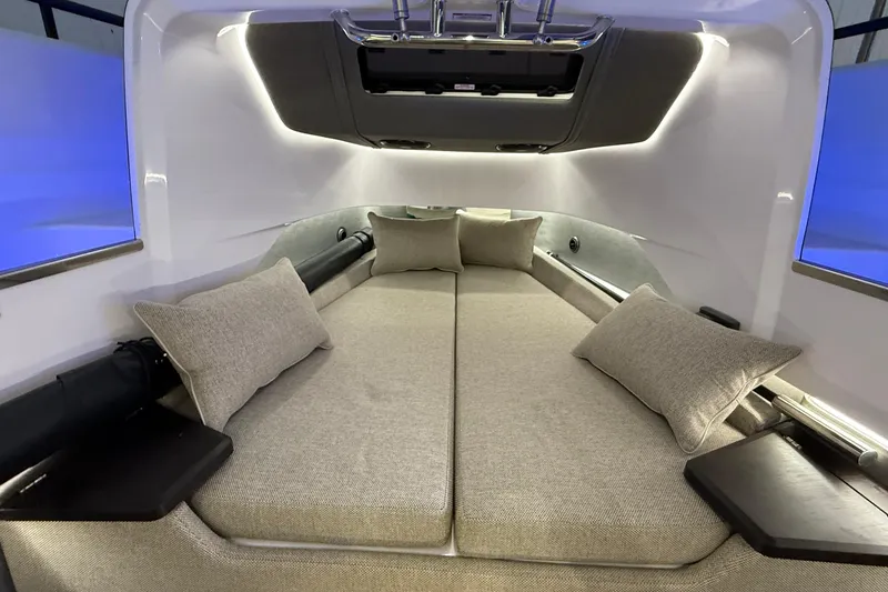 Slide: The Image of 2024 Axopar 37 cabin interior with modern design and comfortable seating. - 13