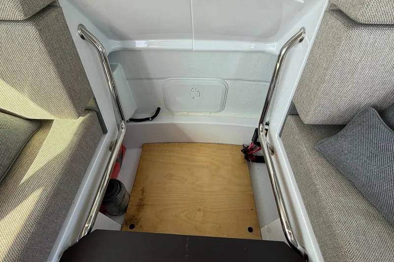 Slide: The Image of 2024 Axopar 37 interior seating area with cushions and wooden flooring. - 30