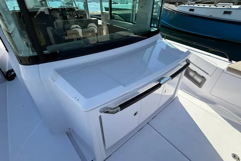 Slide: The Image of 2024 Axopar 37 boat deck with sleek design and modern seating. - 38