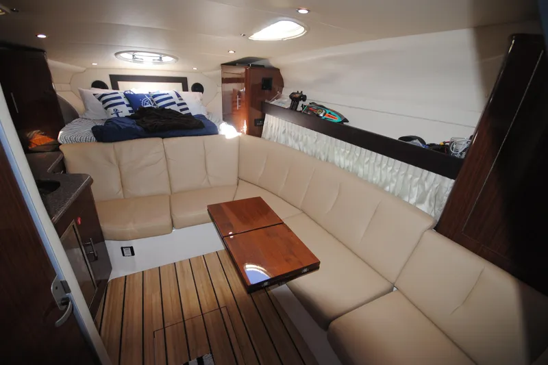 Slide: The Image of Luxurious interior of 2015 Regal 32 Express yacht with cozy seating and elegant decor. - 15
