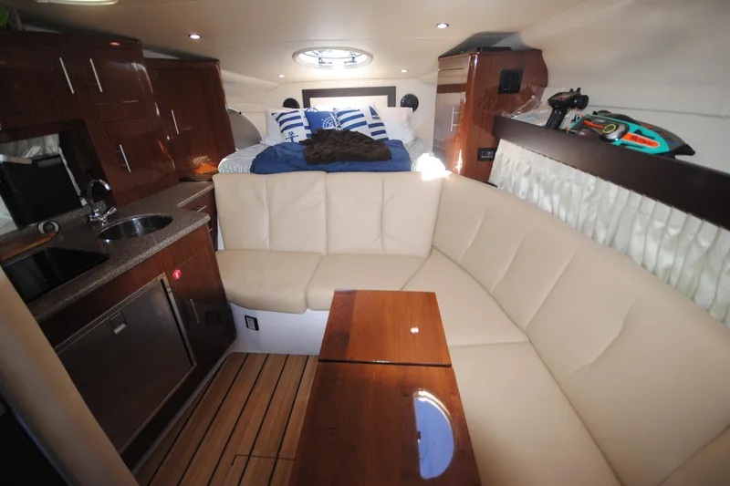 Slide: The Image of Luxurious interior of 2015 Regal 32 Express yacht with cozy seating and modern amenities. - 16