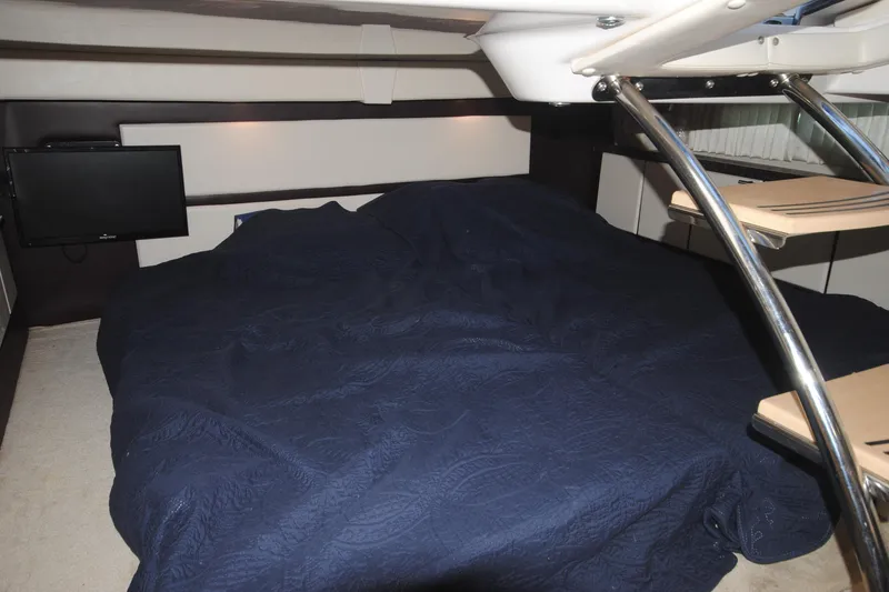 Slide: The Image of Interior cabin of 2015 Regal 32 Express with bed and TV. - 20
