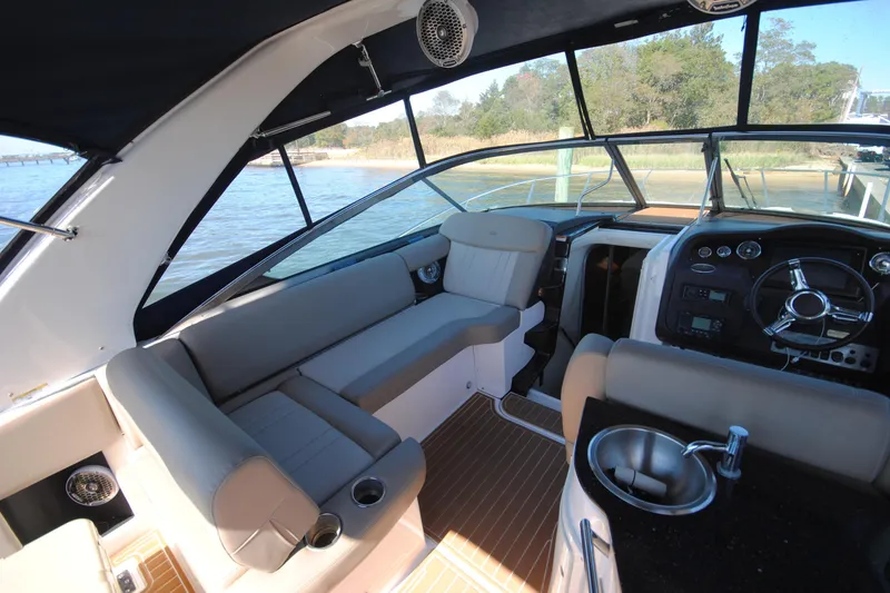 Slide: The Image of Interior of 2015 Regal 32 Express boat with seating and steering wheel. - 6