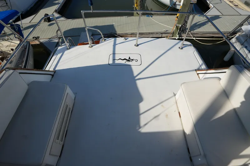 Slide: The Image of 1972 Viking 33 boat deck with seating, docked at marina. - 11