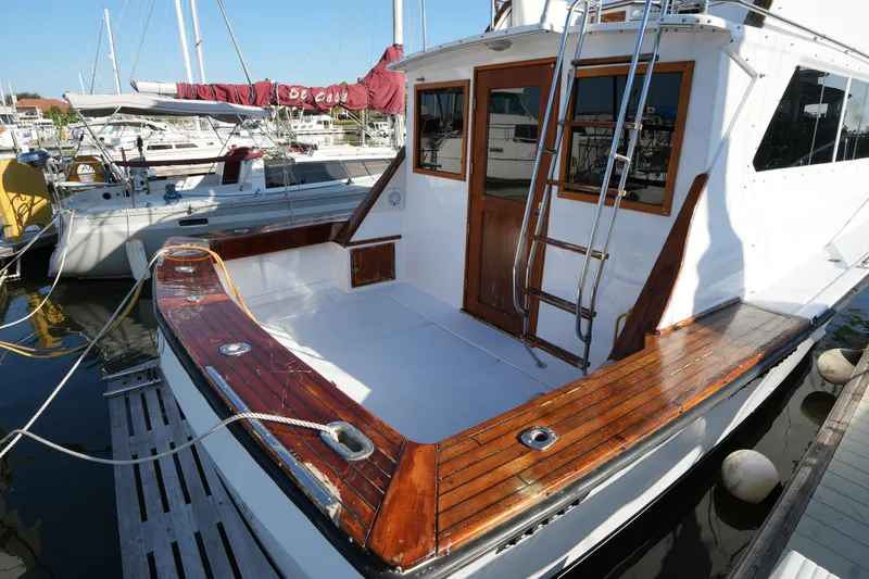 Slide: The Image of 1972 Viking 33 boat with wooden deck, docked at marina. - 3