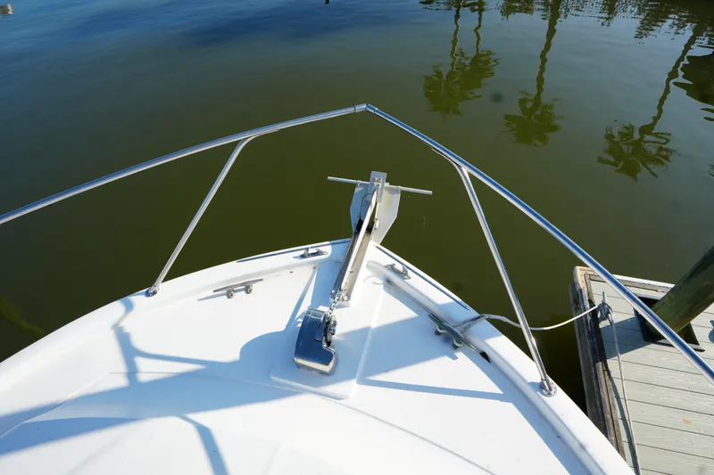 Slide: The Image of Bow of a 1972 Viking 33 boat docked on calm water. - 4