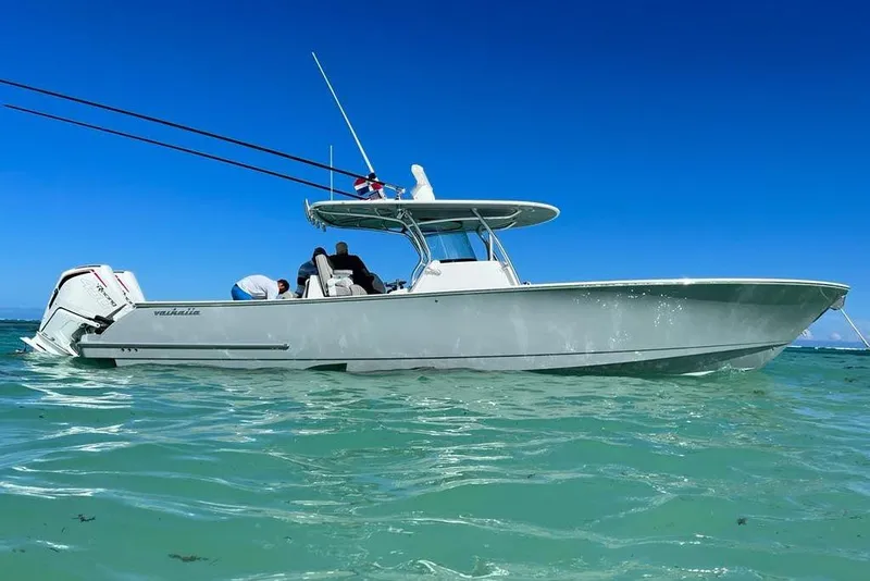 Slide: The Image of 2023 Valhalla Boatworks V-37 in clear blue waters, showcasing sleek design and powerful engines. - 1