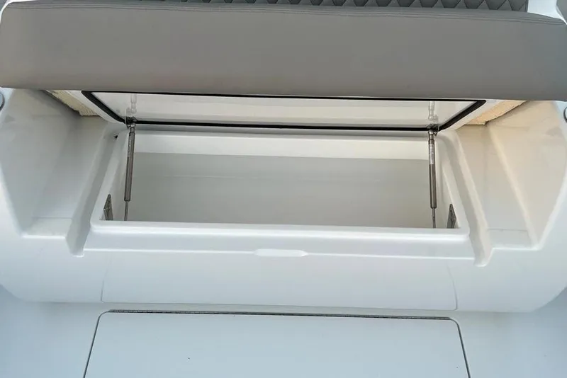 Slide: The Image of 2023 Valhalla Boatworks V-37 storage compartment with open lid, showcasing interior space. - 12