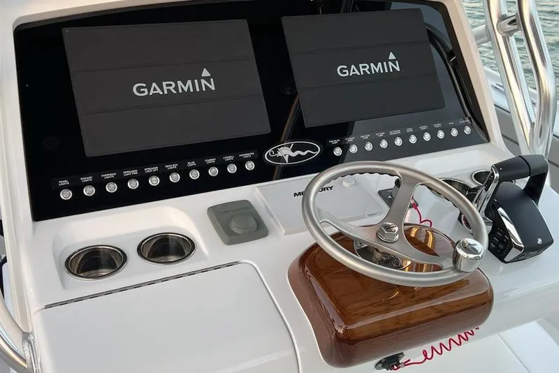 Slide: The Image of 2023 Valhalla Boatworks V-37 helm with dual Garmin displays and steering wheel. - 13