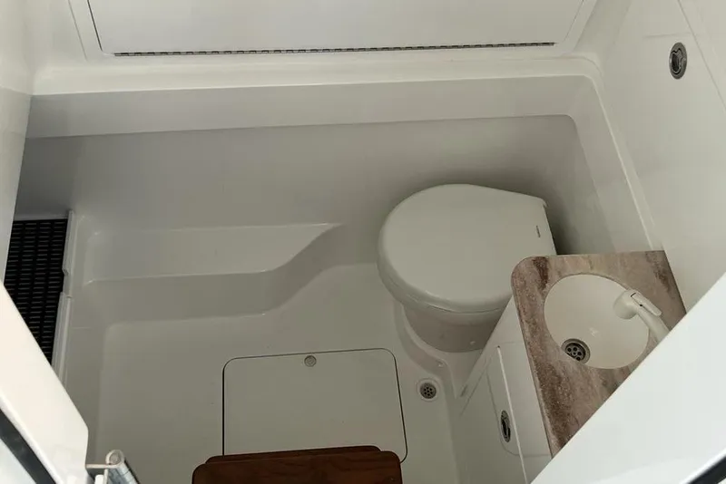 Slide: The Image of 2023 Valhalla Boatworks V-37 interior bathroom with toilet and sink. - 15
