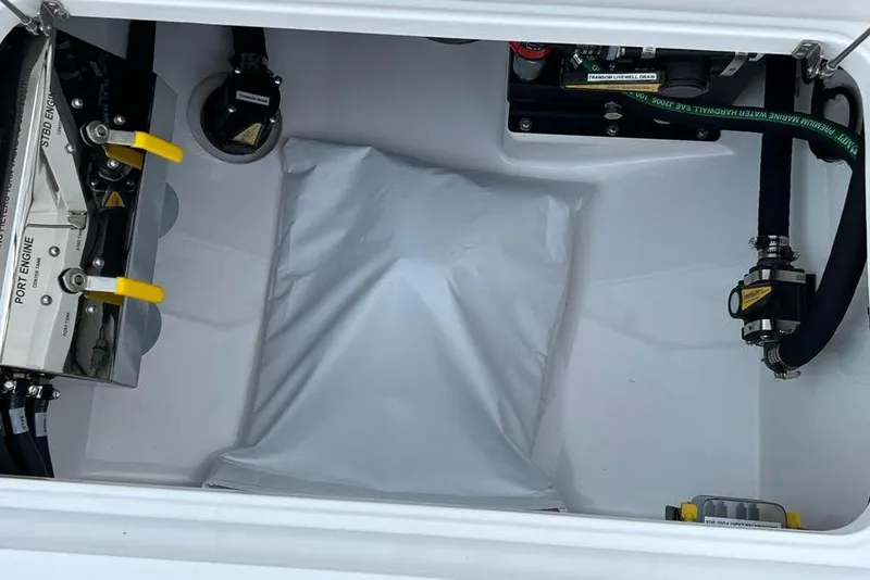 Slide: The Image of 2023 Valhalla Boatworks V-37 engine compartment with visible components and hoses. - 19