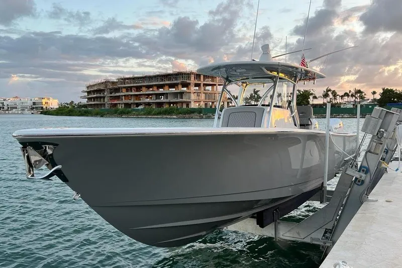 Slide: The Image of 2023 Valhalla Boatworks V-37 docked at sunset, showcasing sleek design and modern features. - 2