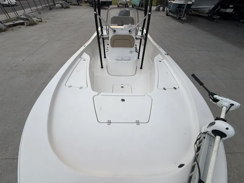 Slide: The Image of 2016 Tidewater 2200 boat on trailer outside boathouse. - 14