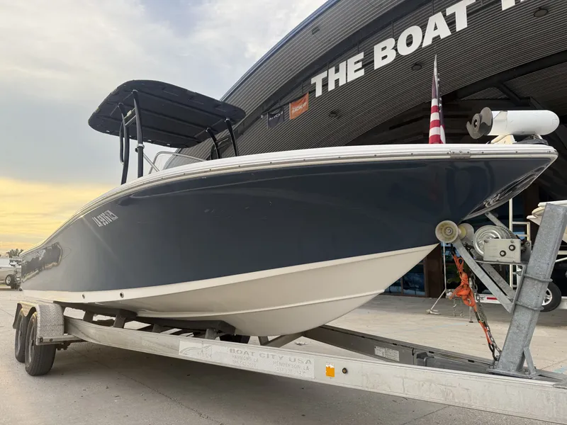 Slide: The Image of 2016 Tidewater 2200 Carolina Bay boat on trailer outside a store. - 7