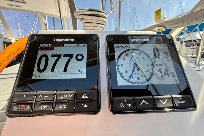Slide: The Image of Raymarine navigation displays on a 2020 Catalina 425 sailboat, showing heading and wind speed. - 15