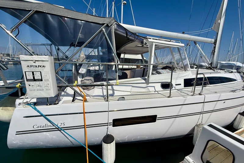 Slide: The Image of 2020 Catalina 425 sailboat docked at marina, featuring sleek design and modern amenities. - 2