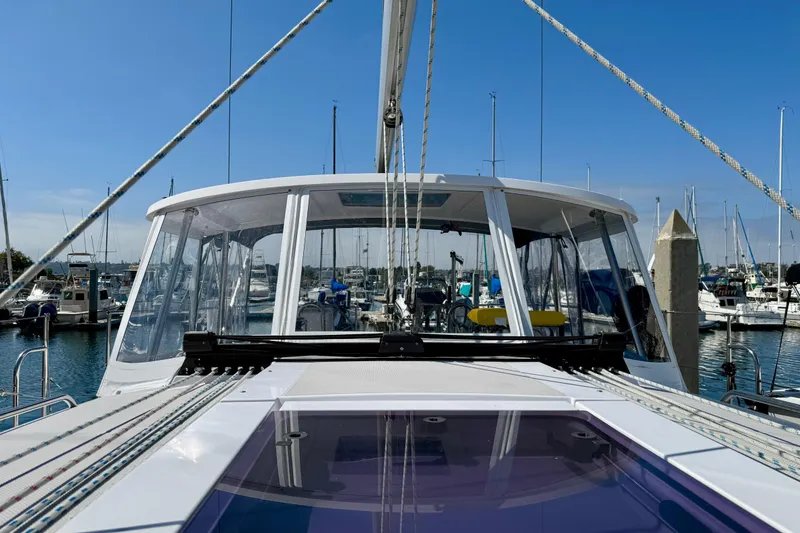 Slide: The Image of 2020 Catalina 425 sailboat docked in marina, showcasing sleek design and clear blue sky. - 29