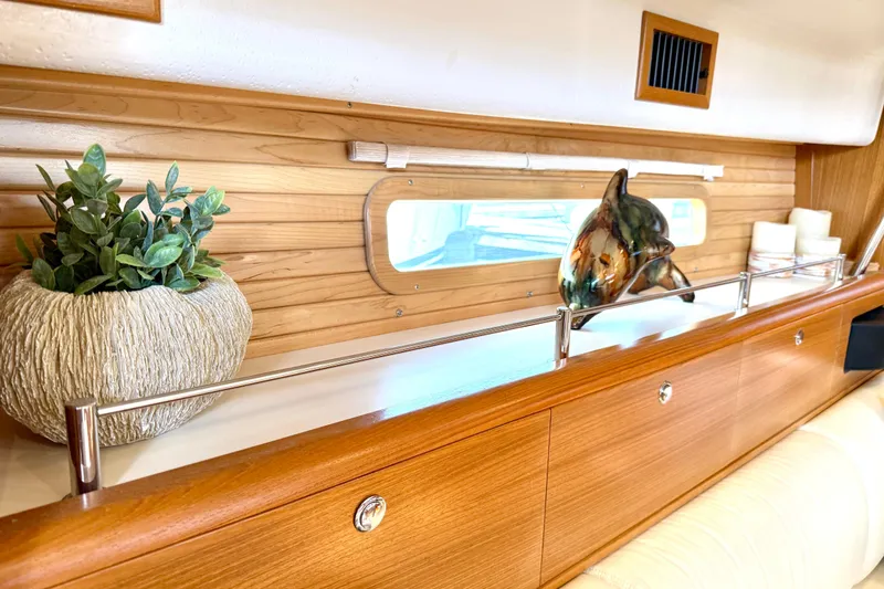 Slide: The Image of Interior of 2020 Catalina 425 yacht with decorative plant and dolphin sculpture. - 40
