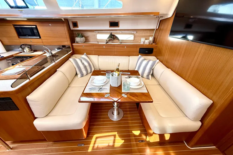 Slide: The Image of Luxurious Catalina 425 yacht interior with elegant dining area, modern kitchen, and cozy seating, 2020 model. - 42