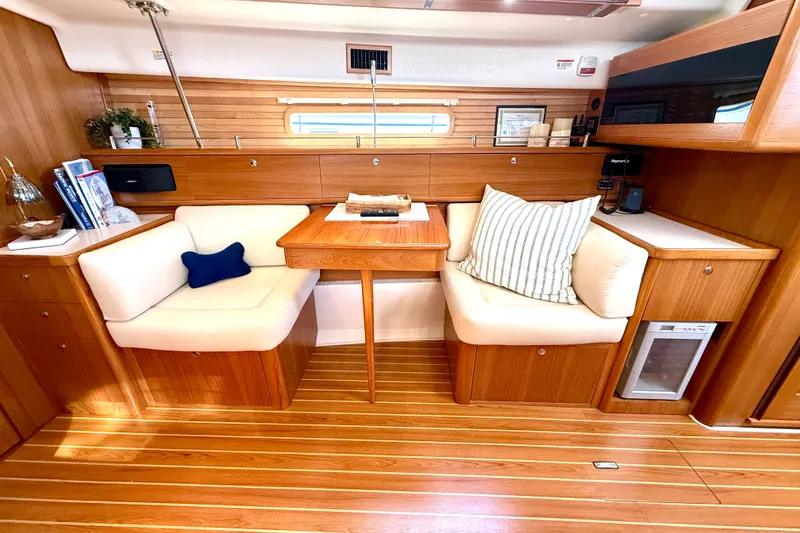 Slide: The Image of Luxurious 2020 Catalina 425 yacht interior with cozy seating and elegant wooden finishes. - 43