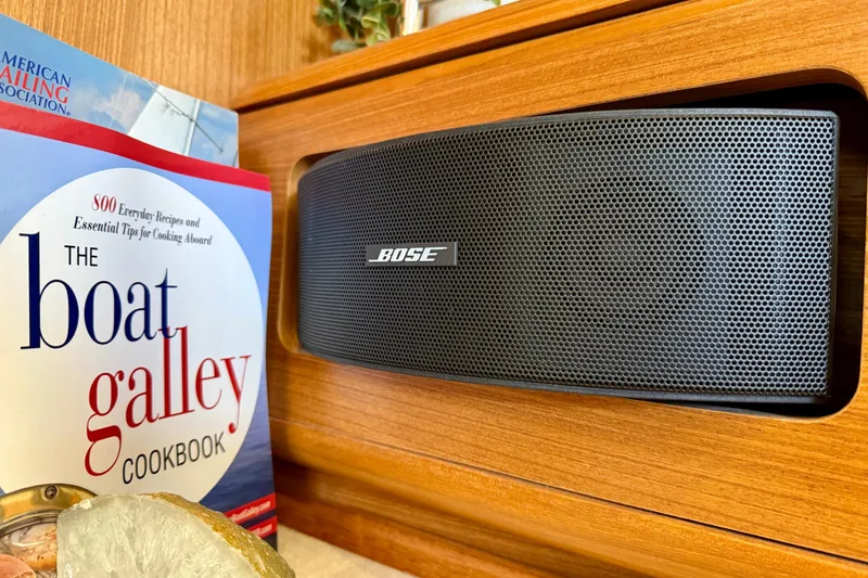 Slide: The Image of Bose speaker and cookbook on Catalina 425 yacht, 2020 model, wooden interior. - 44