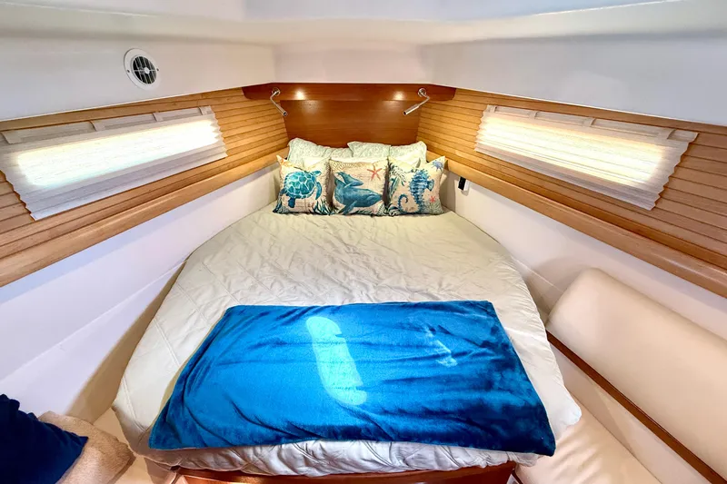 Slide: The Image of Luxurious cabin interior of 2020 Catalina 425 yacht with cozy bedding and nautical decor. - 45