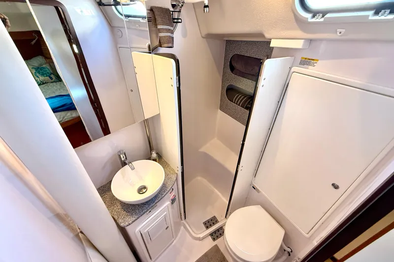 Slide: The Image of Modern bathroom in 2020 Catalina 425 yacht with sink, toilet, and storage. - 47