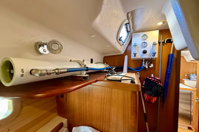 Slide: The Image of Interior of a 2020 Catalina 425 yacht featuring equipment and wooden cabinetry. - 51