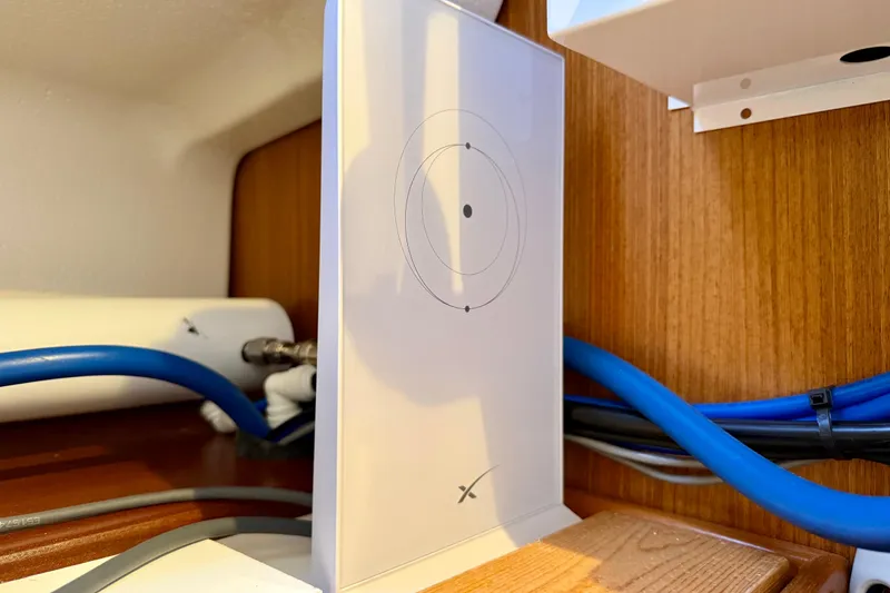 Slide: The Image of Starlink satellite internet setup inside a 2020 Catalina 425 yacht cabin. - 53