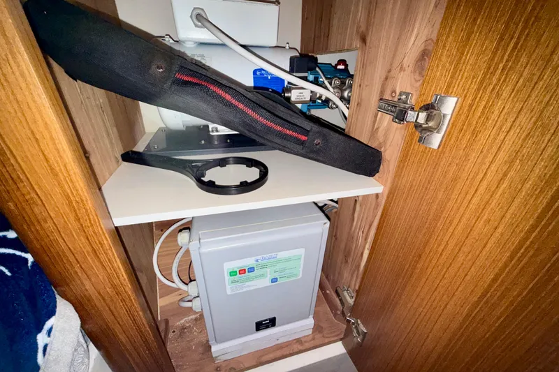 Slide: The Image of Inside a Catalina 425 cabinet, showcasing electrical components and wiring, 2020 model. - 54